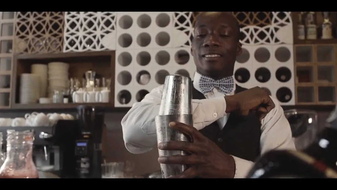 Bartender preparing a cocktail in an on-premise hospitality setting