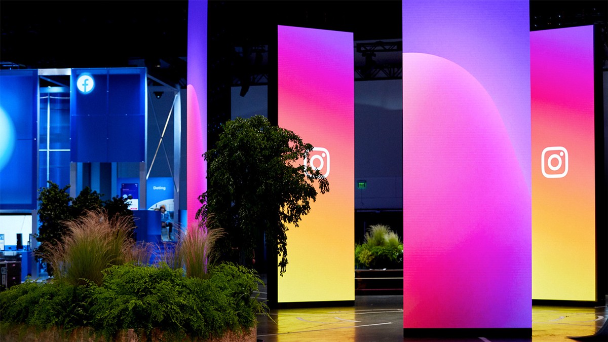Large-format interactive event installation with illuminated screens and a planted environment